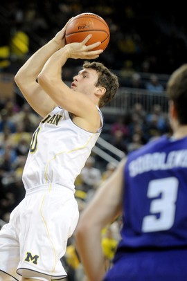 Michigan senior Zack Novak takes a shot early in the first quarter against Northwestern at Crisler Center on Wedensday. Melanie Maxwell I AnnArbor.com